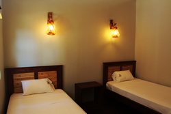 The second bedroom in each Kites Mancora house is furnished with two twin beds